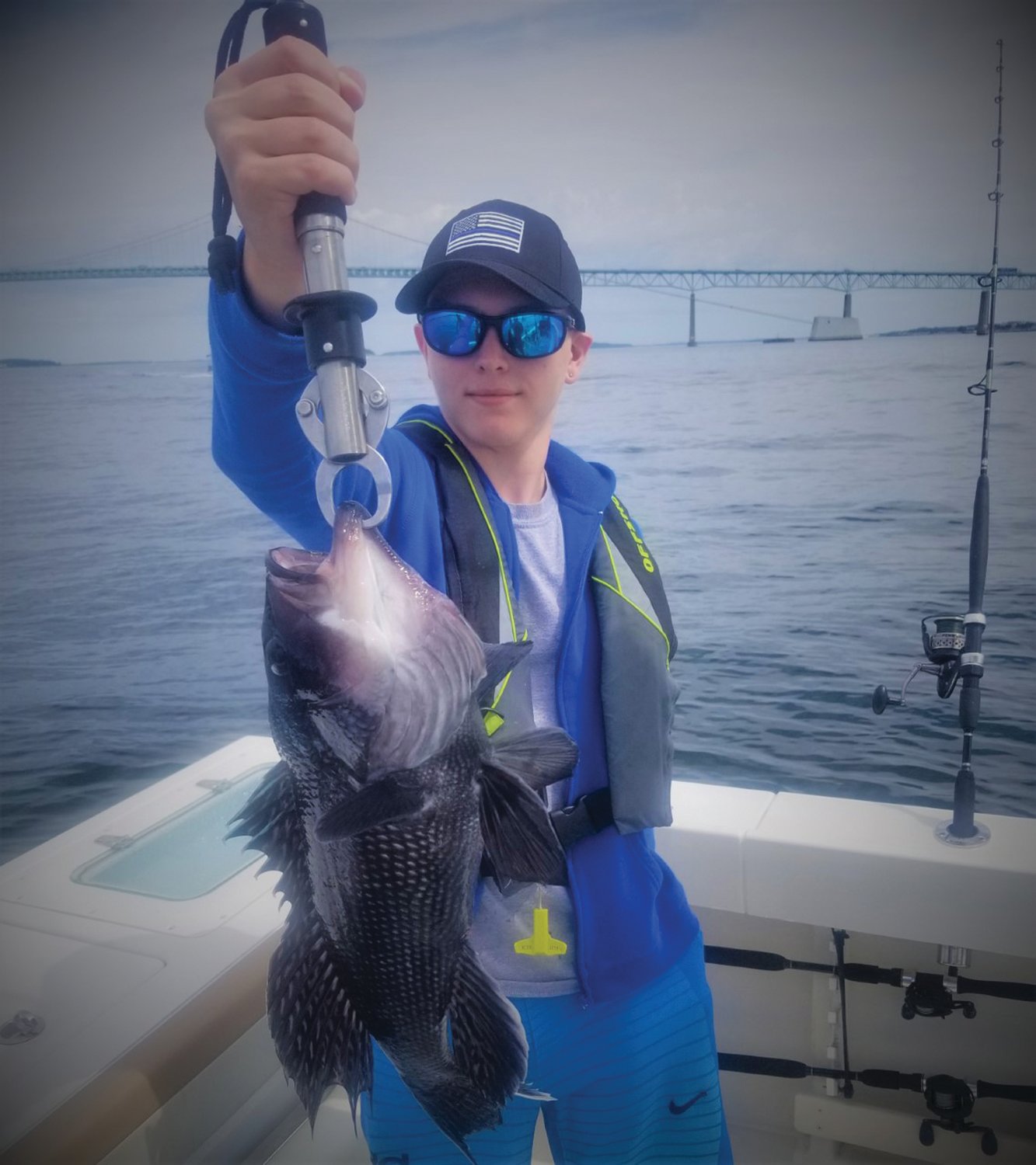 BIG CATCH: Reicher caught this 19-inch black sea bass at the Newport Bridge fishing with his grandfather Ed Jacques and his grandfather’s brother Richard Jacques.